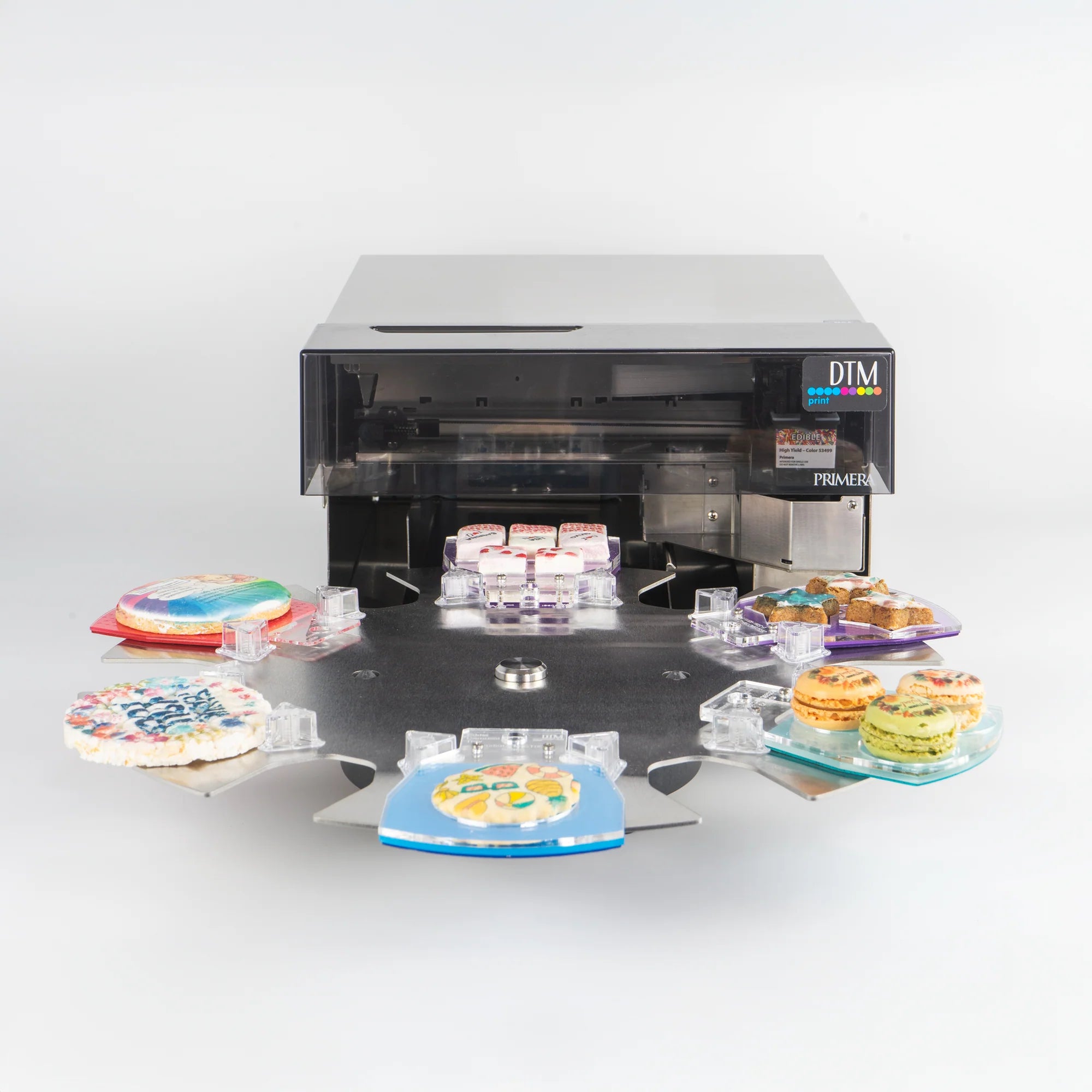 Eddie Edible Ink Printer - Fullfarge spiselig blekkskriver (Bestillingsvare) bruker et roterende brett til å skrive ut livlige motiver direkte på kaker og makroner.