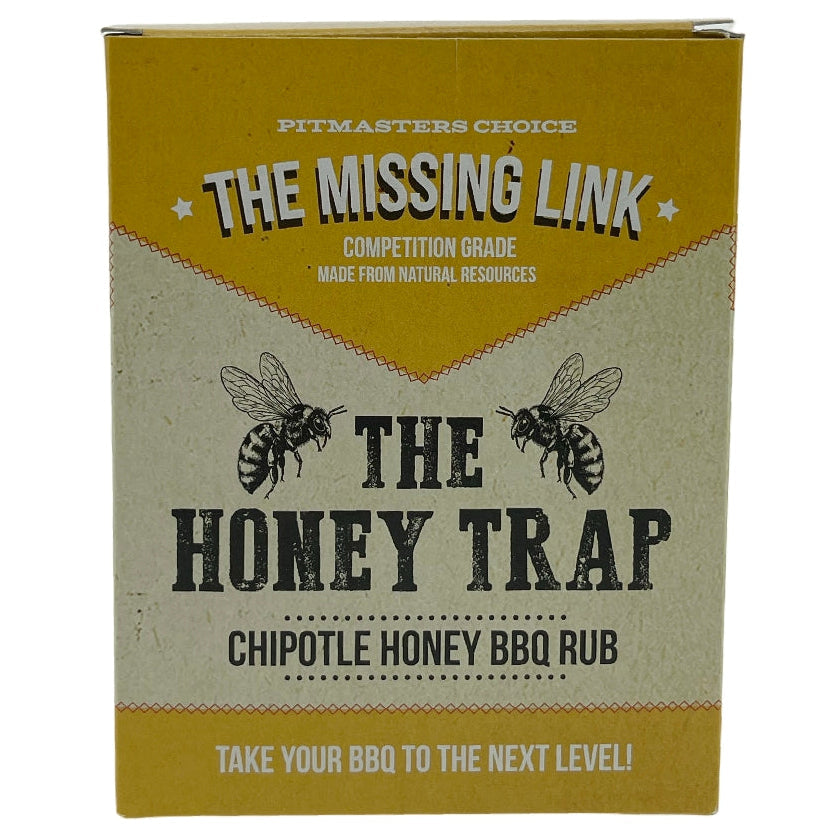 En eske med «The Missing Link Honey Trap BBQ Rub» med illustrasjoner av bier og produktinformasjon på forsiden, som inneholder denne smakfulle rubben med honning og chipotle samt en unik BBQ-krydderblanding.
